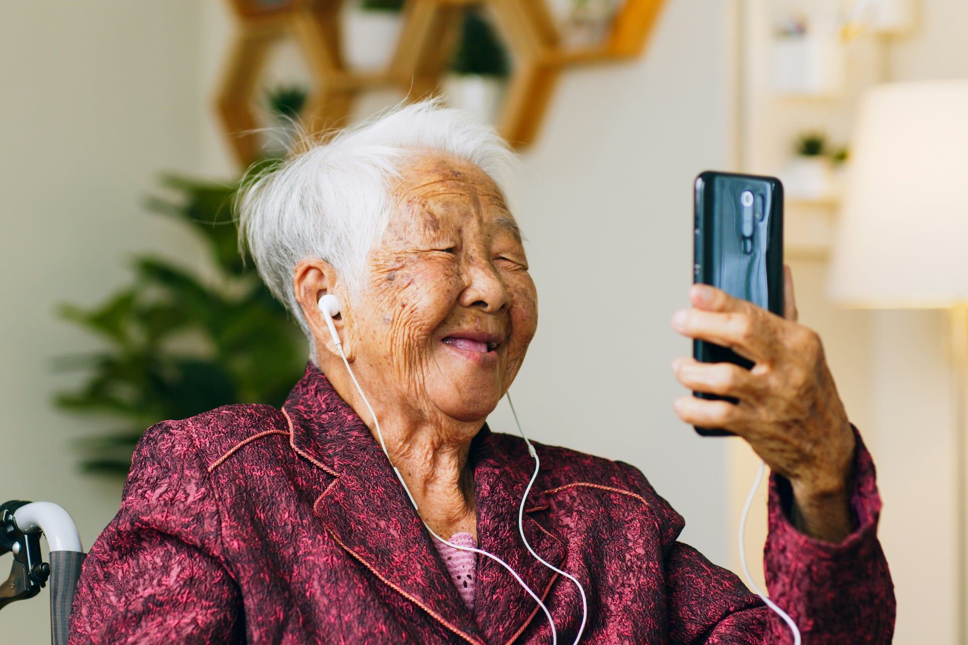 Elderly woman recording her story on smartphone